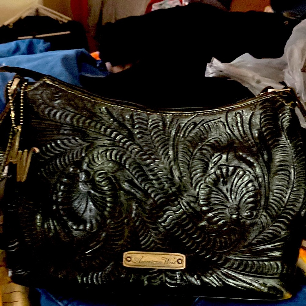 American West shoulder bag.  Black in color with silver accents.